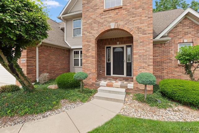 3054 Windmill Dr, Adrian, MI 49221 - entrance to property featuring roof with shingles and brick siding
