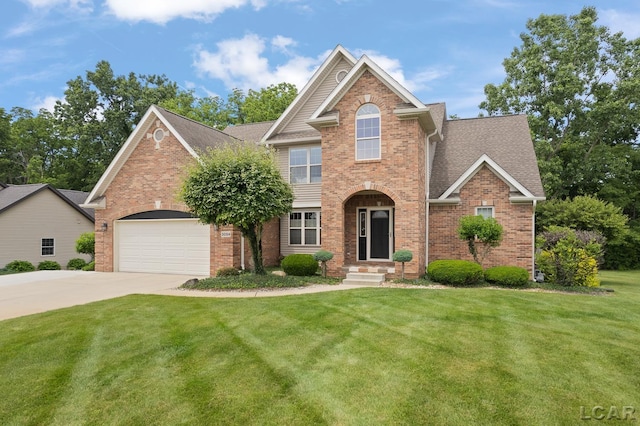 3054 Windmill Dr, Adrian, MI 49221 - traditional-style home featuring brick siding, concrete driveway, a front lawn, roof with shingles, and a garage