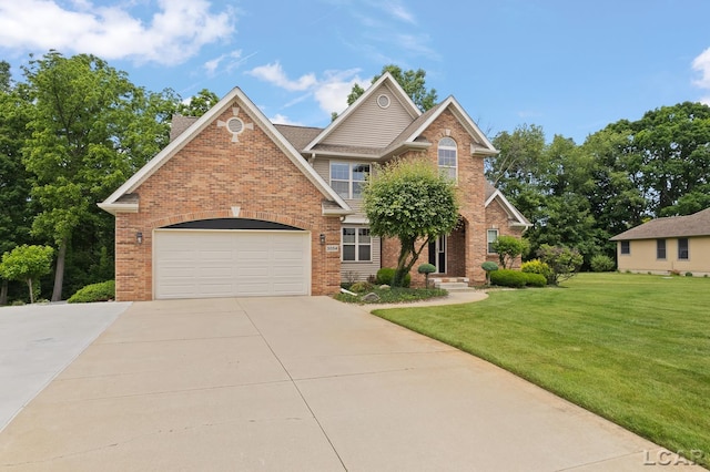 3054 Windmill Dr, Adrian, MI 49221 - view of front of house featuring brick siding, concrete driveway, a front lawn, and a garage