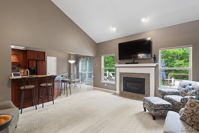 3054 Windmill Dr, Adrian, MI 49221 - living room featuring high vaulted ceiling, light carpet, a fireplace with flush hearth, and recessed lighting