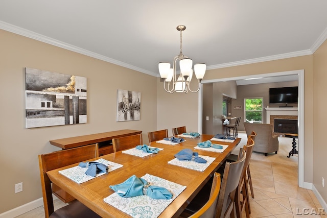 3054 Windmill Dr, Adrian, MI 49221 - dining room with crown molding, a chandelier, light tile patterned flooring, and a glass covered fireplace