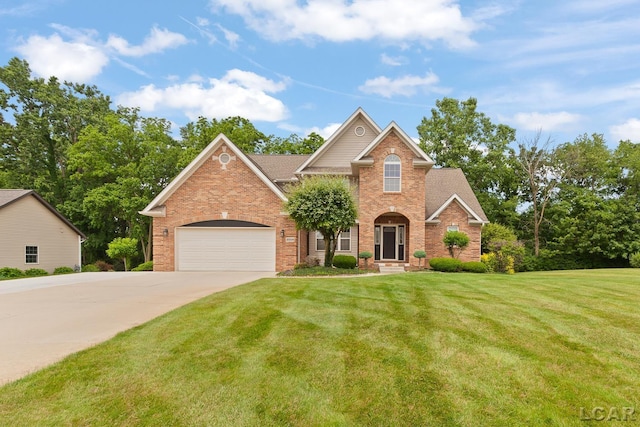3054 Windmill Dr, Adrian, MI 49221 - traditional home featuring brick siding, driveway, a front yard, and an attached garage