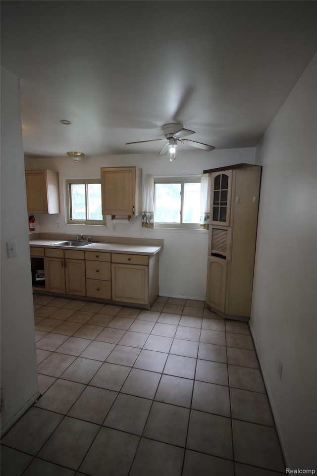 21325 Marie Ave, Warren, MI 48089 - kitchen featuring healthy amount of natural light, ceiling fan, light countertops, and light brown cabinetry