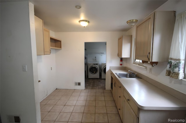 21325 Marie Ave, Warren, MI 48089 - kitchen with washer and clothes dryer, light countertops, and light tile patterned floors