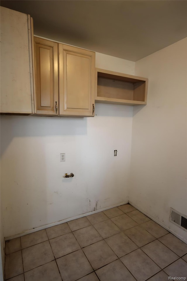 21325 Marie Ave, Warren, MI 48089 - laundry room with light tile patterned flooring