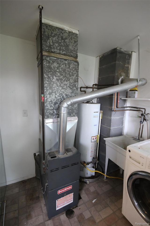21325 Marie Ave, Warren, MI 48089 - laundry area featuring water heater and washer / clothes dryer