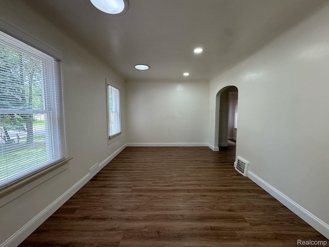28905 Hennepin St, Dearborn Heights, MI 48135 - empty room with arched walkways, recessed lighting, and dark wood-style flooring