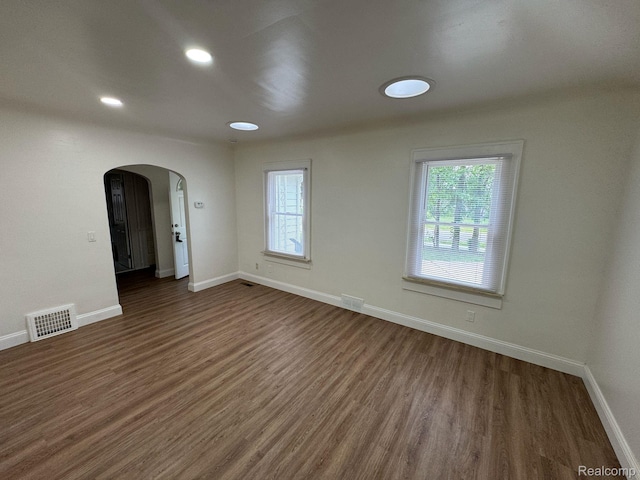 28905 Hennepin St, Dearborn Heights, MI 48135 - spare room with arched walkways, wood finished floors, and recessed lighting