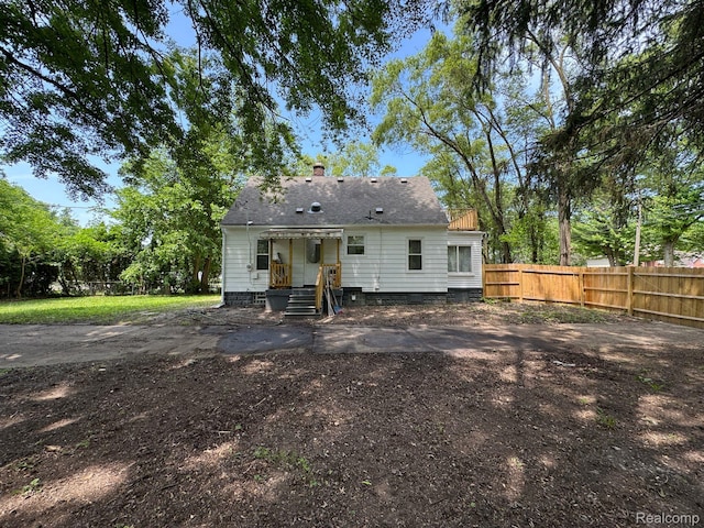 28905 Hennepin St, Dearborn Heights, MI 48135 - back of property featuring a chimney and a shingled roof
