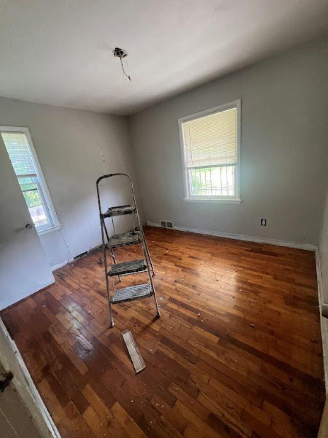 3501 Fleming Rd, Flint, MI 48504 - unfurnished bedroom featuring wood-type flooring and baseboards