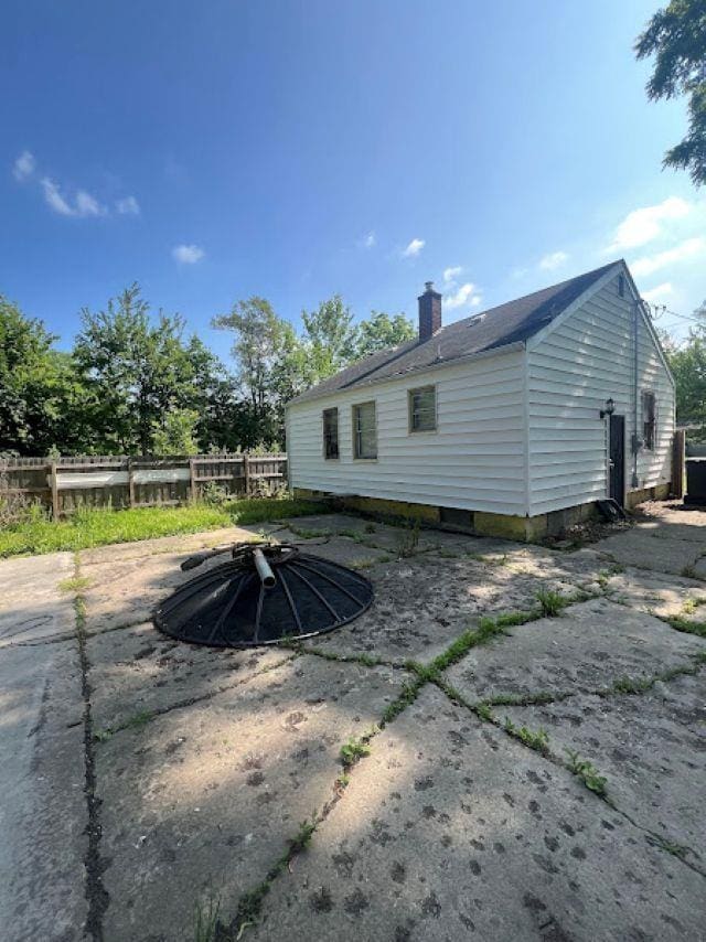 3501 Fleming Rd, Flint, MI 48504 - back of house with a chimney