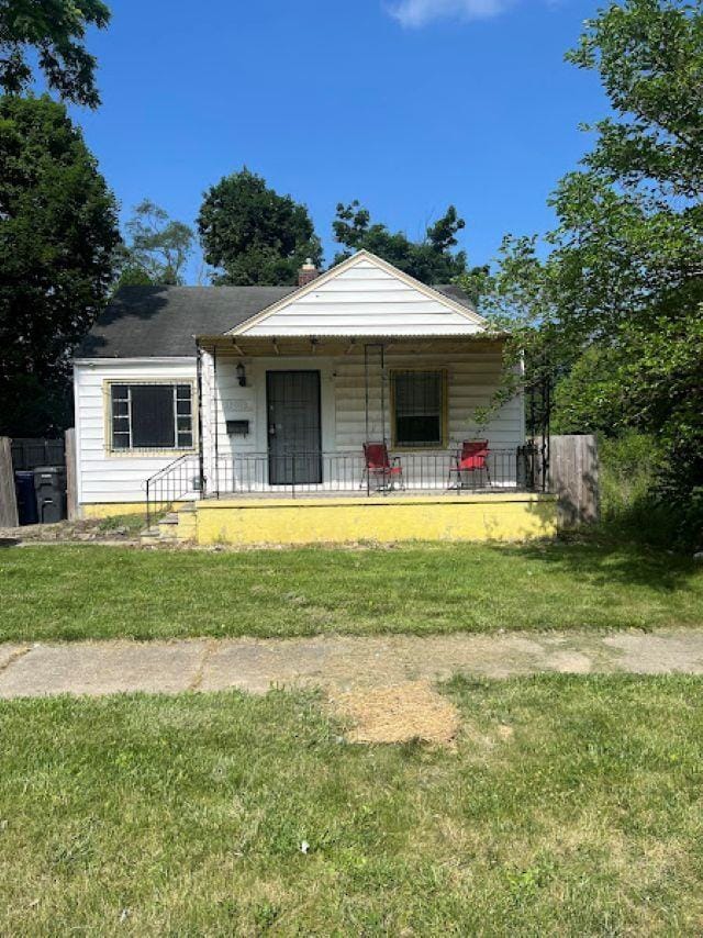 3501 Fleming Rd, Flint, MI 48504 - bungalow featuring a porch and a front lawn