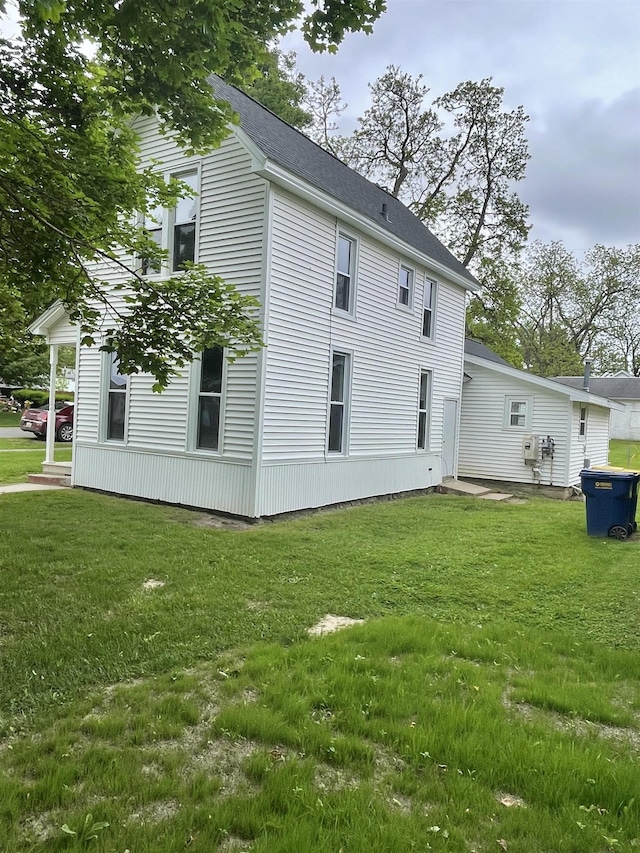 301 W State St, Corunna, MI 48817 - back of house featuring a lawn
