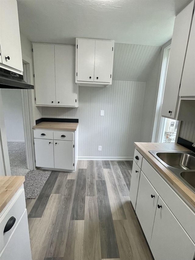 301 W State St, Corunna, MI 48817 - kitchen with wood finished floors and white cabinets