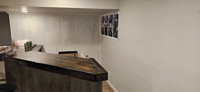 219 Walnut Woods Ct, Plainwell, MI 49080 - bar with wood finished floors and baseboards