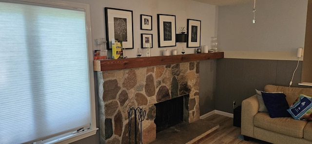 219 Walnut Woods Ct, Plainwell, MI 49080 - living room with wood finished floors, a bar, and a fireplace