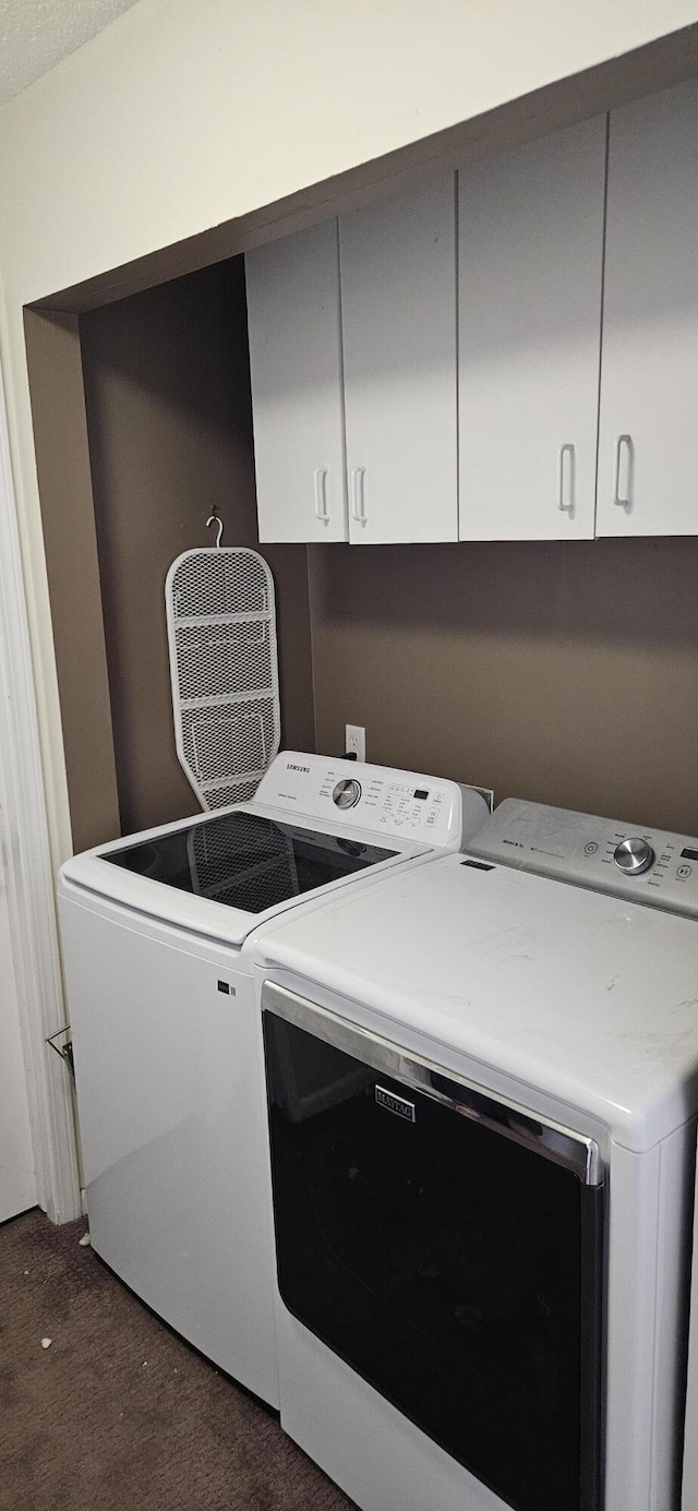 219 Walnut Woods Ct, Plainwell, MI 49080 - washroom with independent washer and dryer, dark carpet, and cabinet space