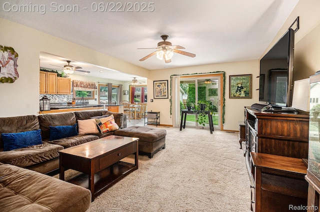 9300 Clippert St, Taylor, MI 48180 - living room featuring a ceiling fan and light colored carpet