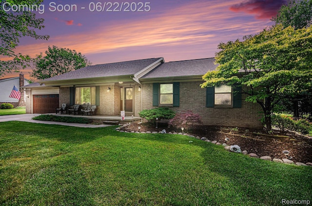 9300 Clippert St, Taylor, MI 48180 - single story home with brick siding, a front lawn, an attached garage, concrete driveway, and a porch