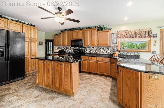 9300 Clippert St, Taylor, MI 48180 - kitchen with black appliances, ceiling fan, tasteful backsplash, a center island, and dark stone counters