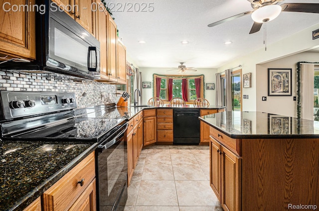 9300 Clippert St, Taylor, MI 48180 - kitchen featuring black appliances, a ceiling fan, brown cabinets, backsplash, and a peninsula