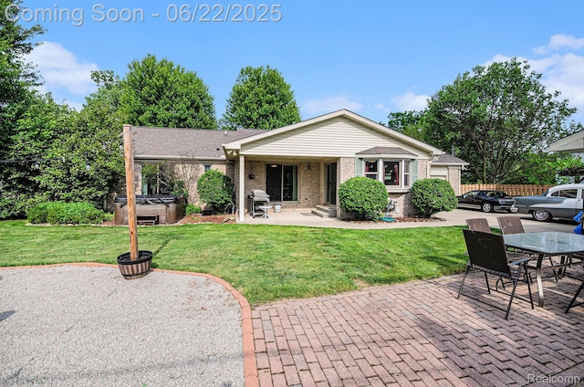 9300 Clippert St, Taylor, MI 48180 - back of house featuring a hot tub, a patio, brick siding, and outdoor dining area