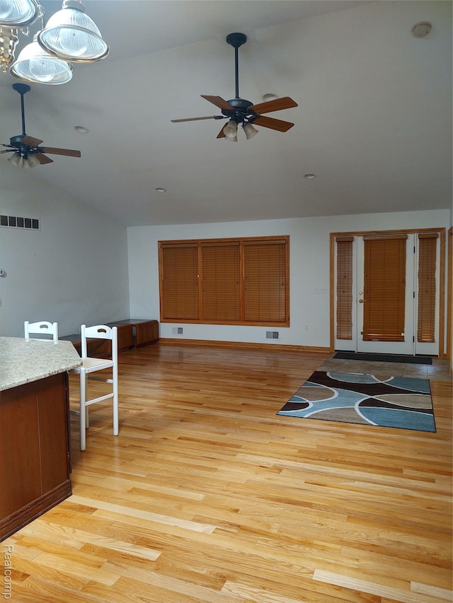 8996 Main St, Whitmore Lake, MI 48189 - unfurnished living room with a ceiling fan, light wood finished floors, and high vaulted ceiling