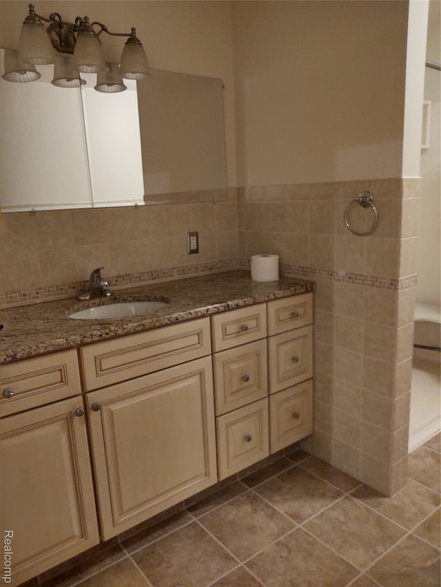 8996 Main St, Whitmore Lake, MI 48189 - full bath featuring tile walls, tile patterned floors, vanity, and a wainscoted wall
