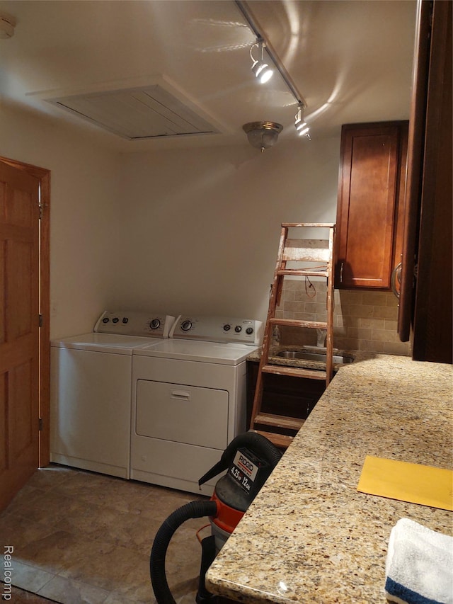 8996 Main St, Whitmore Lake, MI 48189 - laundry room featuring attic access, rail lighting, and independent washer and dryer