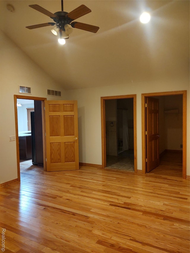 8996 Main St, Whitmore Lake, MI 48189 - unfurnished room featuring a ceiling fan, light wood finished floors, high vaulted ceiling, and a smoke detector