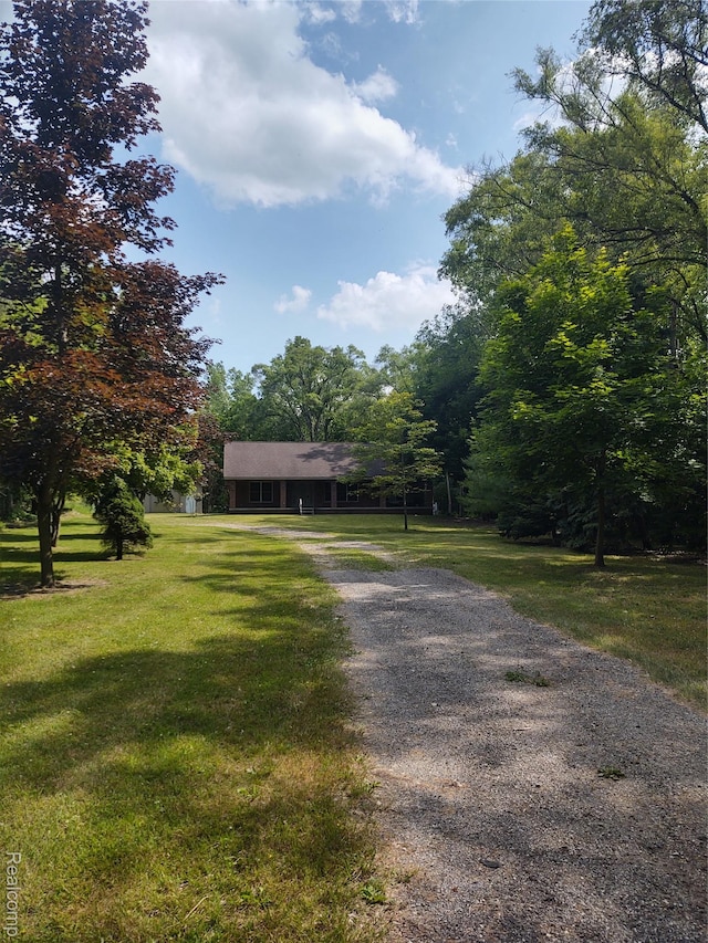 8996 Main St, Whitmore Lake, MI 48189 - view of front of home with driveway and a front yard