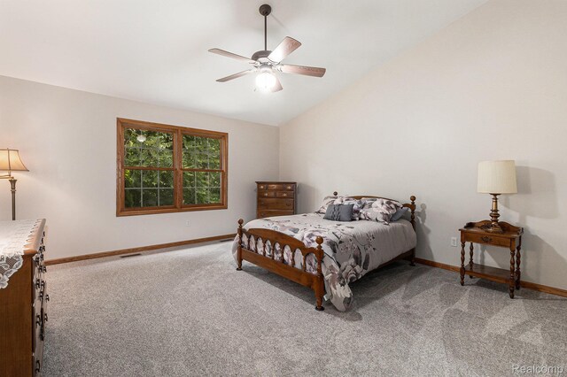 6144 Northridge Hills Dr, Brighton, MI 48116 - bedroom featuring carpet floors, vaulted ceiling, and a ceiling fan