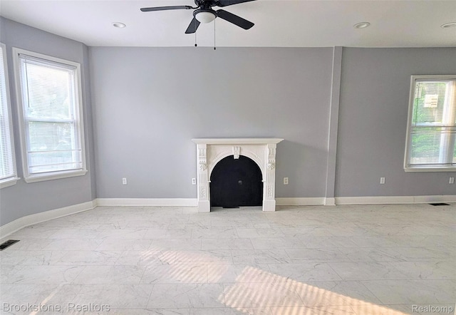 2520 Seyburn St, Detroit, MI 48214 - unfurnished living room featuring a ceiling fan, a fireplace, light marble finish floors, and recessed lighting