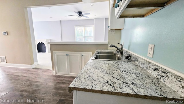 2520 Seyburn St, Detroit, MI 48214 - kitchen featuring dark wood-type flooring, a ceiling fan, white cabinets, light countertops, and ventilation hood