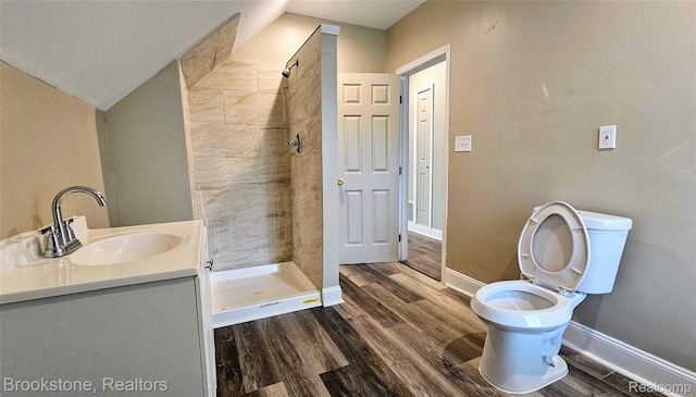 2520 Seyburn St, Detroit, MI 48214 - full bath featuring wood finished floors, a stall shower, vanity, and vaulted ceiling