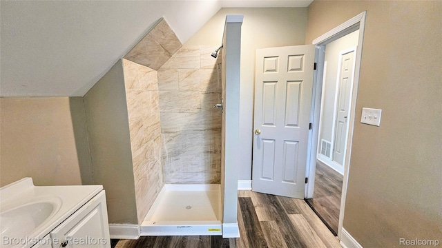 2520 Seyburn St, Detroit, MI 48214 - bathroom with wood finished floors, a stall shower, and vanity