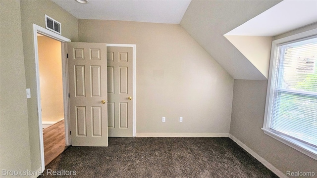 2520 Seyburn St, Detroit, MI 48214 - additional living space featuring vaulted ceiling and dark colored carpet