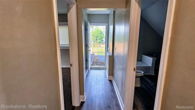 2520 Seyburn St, Detroit, MI 48214 - hall featuring dark wood-style flooring, a textured wall, and vaulted ceiling