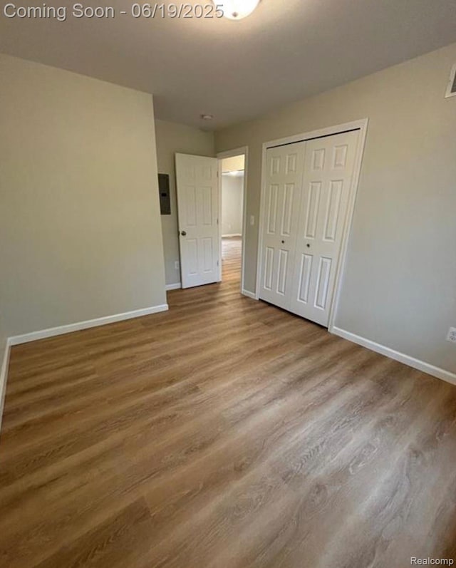29264 Gloede Dr, Warren, MI 48088 - unfurnished bedroom with wood finished floors and a closet