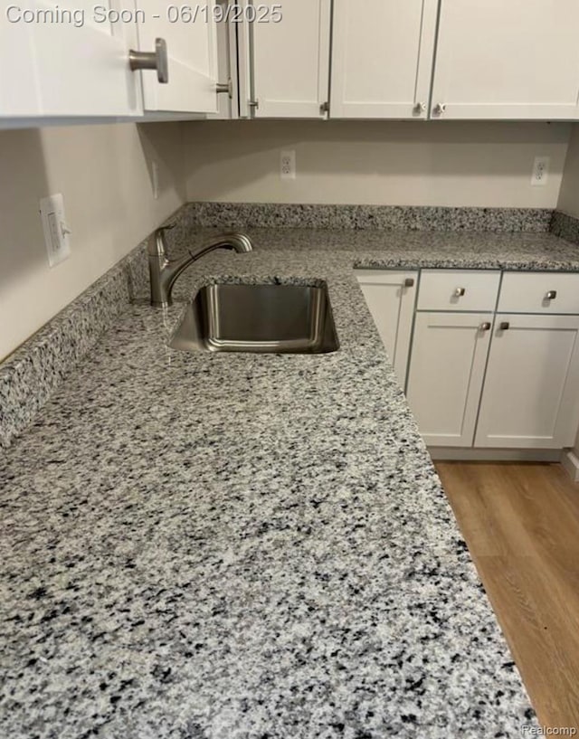 29264 Gloede Dr, Warren, MI 48088 - kitchen with white cabinets and light stone counters