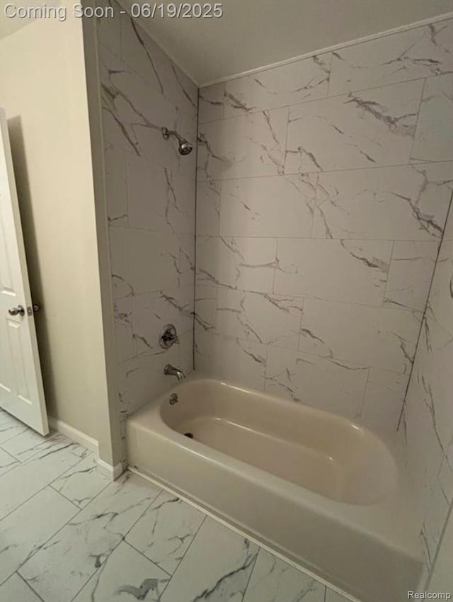 29264 Gloede Dr, Warren, MI 48088 - bathroom with marble look tile flooring and bathtub / shower combination
