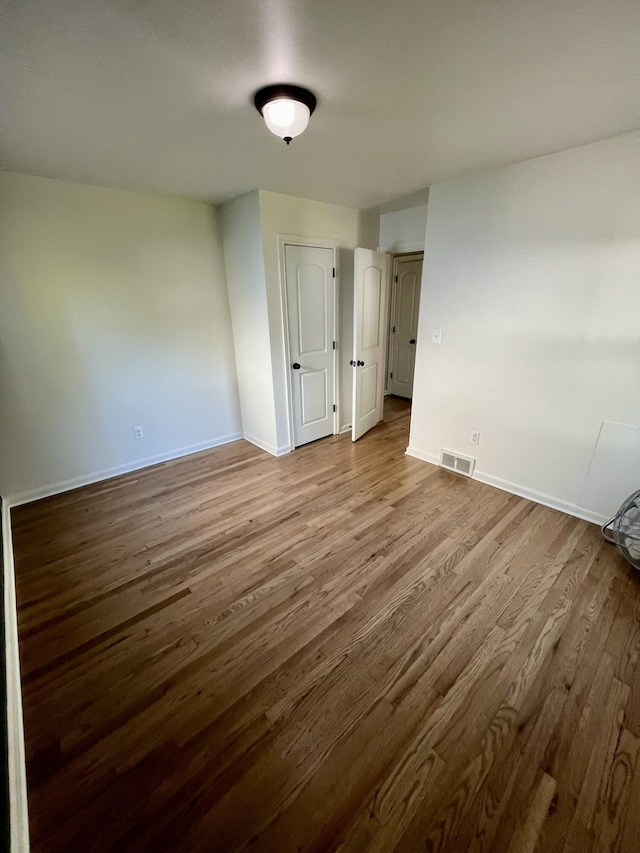 22026 Alger St, Saint Clair Shores, MI 48080 - empty room featuring wood finished floors and baseboards