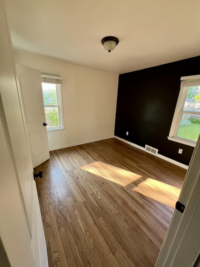22026 Alger St, Saint Clair Shores, MI 48080 - unfurnished room with wood finished floors and healthy amount of natural light