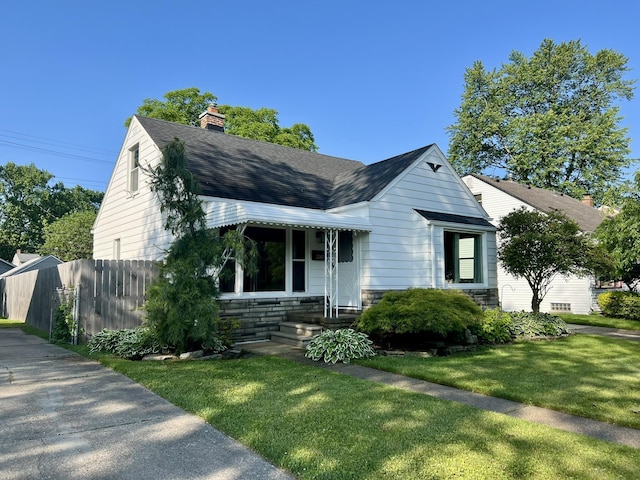 22026 Alger St, Saint Clair Shores, MI 48080 - bungalow-style house featuring stone siding, roof with shingles, and a chimney