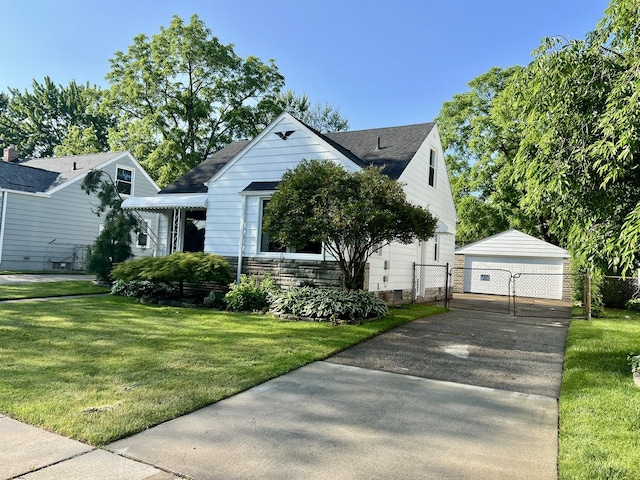 22026 Alger St, Saint Clair Shores, MI 48080 - bungalow-style house with a gate, an outbuilding, a detached garage, and a shingled roof