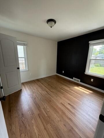 22026 Alger St, Saint Clair Shores, MI 48080 - spare room featuring plenty of natural light and wood finished floors