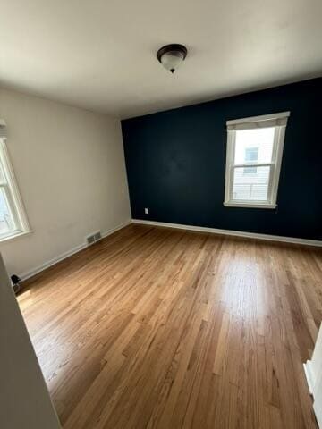 22026 Alger St, Saint Clair Shores, MI 48080 - empty room featuring plenty of natural light and wood finished floors