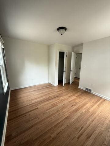 22026 Alger St, Saint Clair Shores, MI 48080 - unfurnished room with light wood-style flooring and baseboards