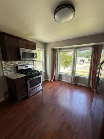 22026 Alger St, Saint Clair Shores, MI 48080 - kitchen featuring stainless steel appliances, dark wood-type flooring, tasteful backsplash, dark brown cabinetry, and light countertops