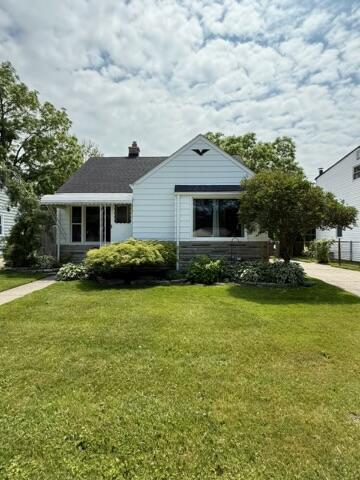 22026 Alger St, Saint Clair Shores, MI 48080 - bungalow with a front yard and a chimney